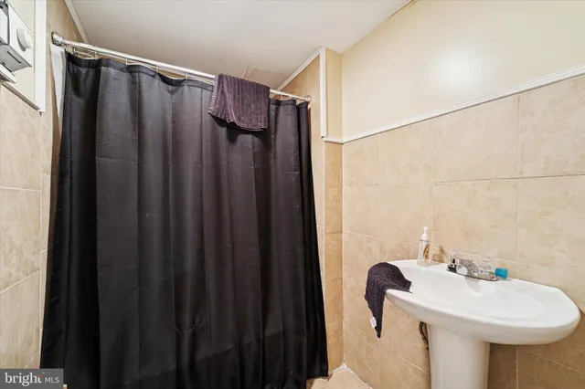 a bathroom with a sink and mirror