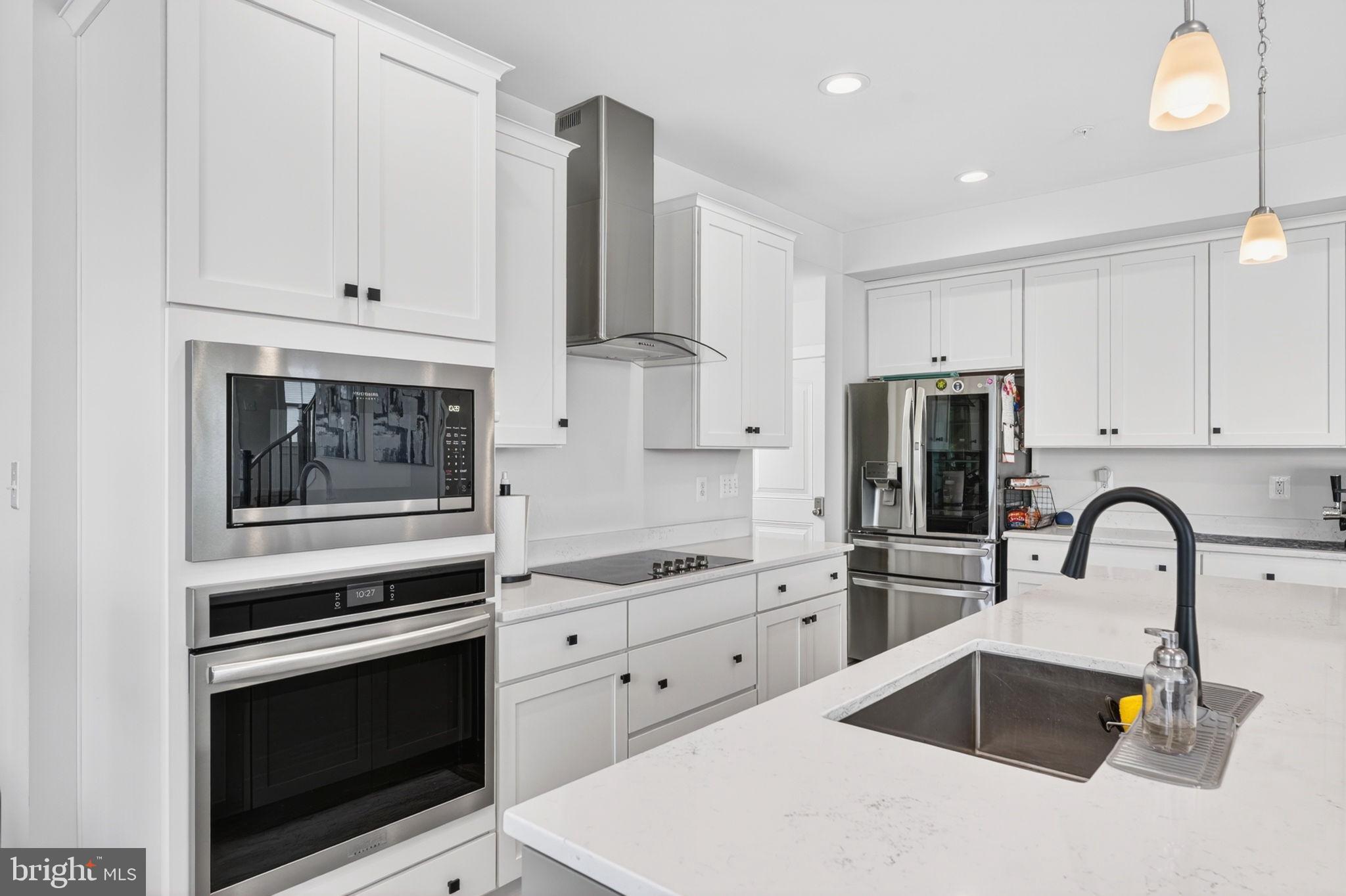 30 Range Road North East, MD 21901 - Photo 17 of 73 a kitchen with granite countertop white cabinets and stainless steel appliances