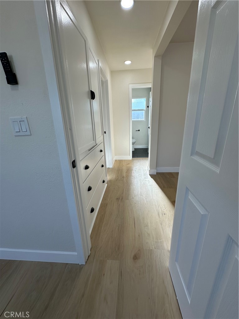 4364 Vía San Luis Riverside, CA 92504 - Photo 13 of 23 a view of a hallway with wooden floor