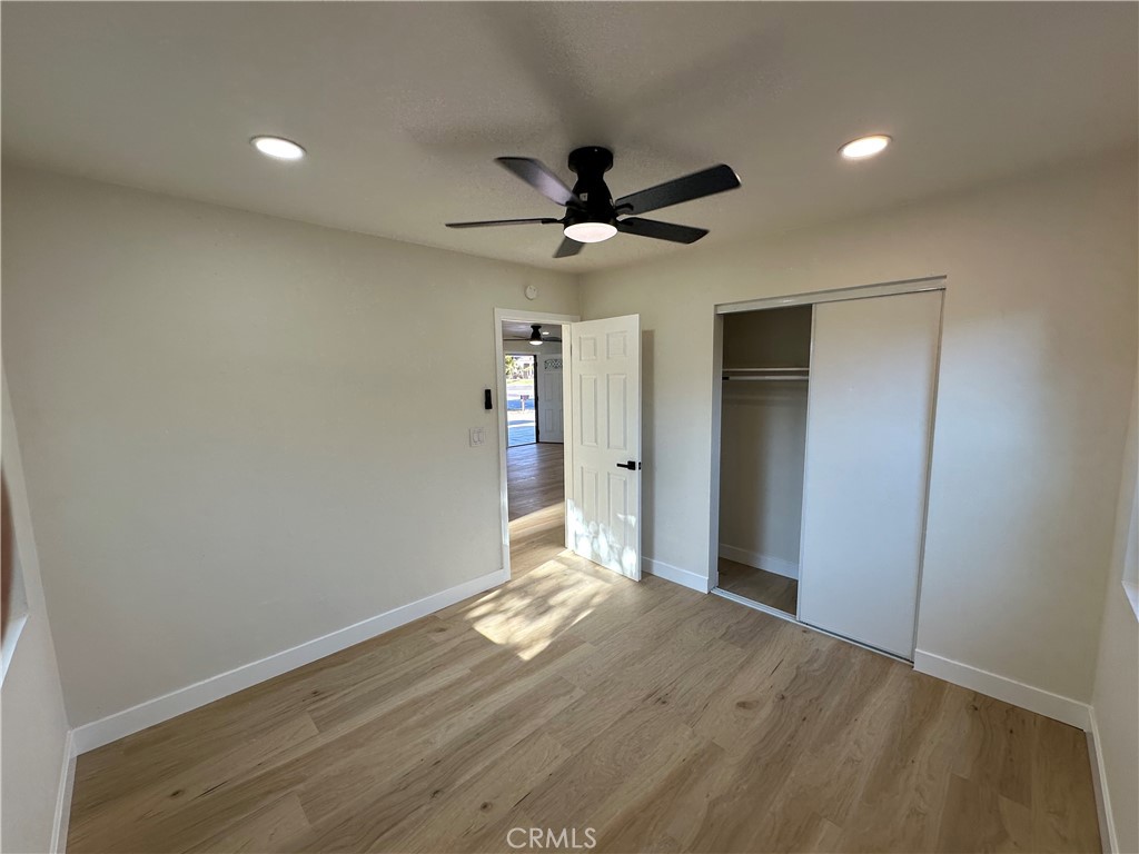 4364 Vía San Luis Riverside, CA 92504 - Photo 15 of 23 an empty room with wooden floor and a ceiling fan