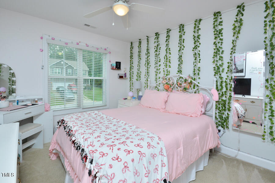 195 Timberwind Road Franklinton, NC 27525 - Photo 20 of 28 a bedroom with a bed and a window