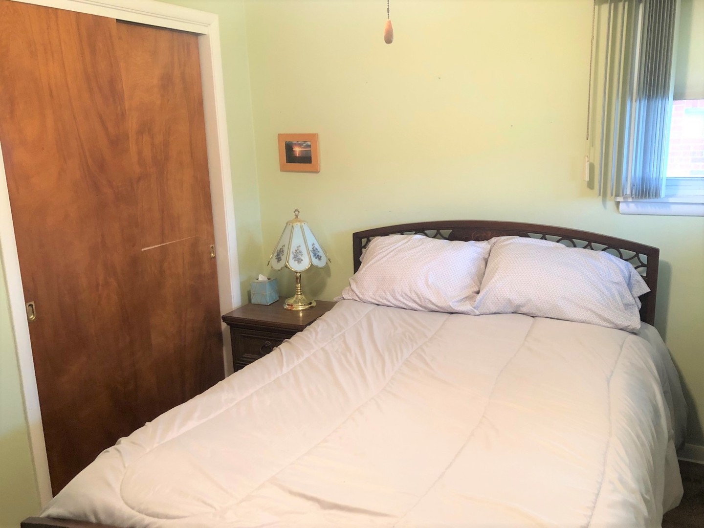 408 North Aldine Avenue Park Ridge, IL 60068 - Photo 7 of 12 a bedroom with a bed and a window