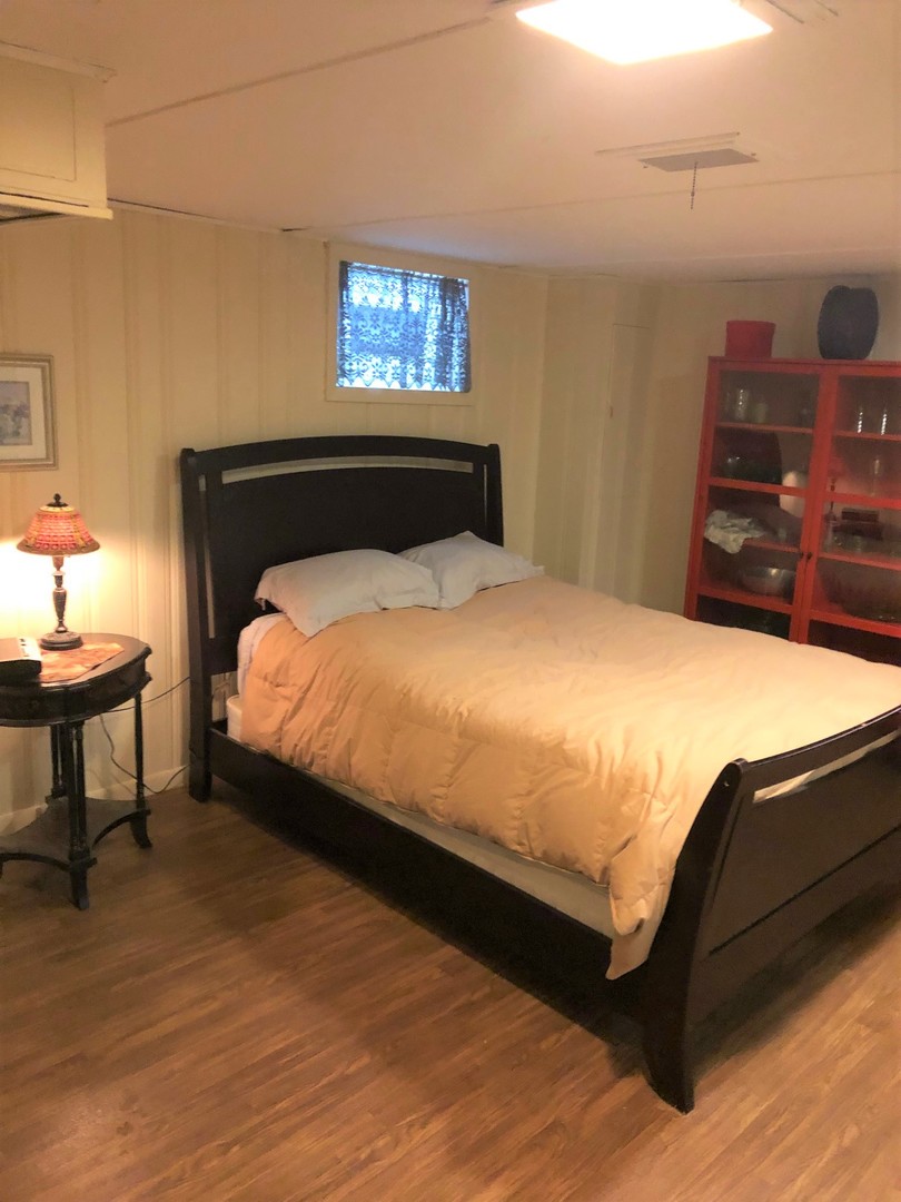 408 North Aldine Avenue Park Ridge, IL 60068 - Photo 8 of 12 a bedroom with a bed and dresser