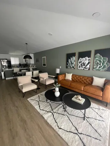 a living room with furniture and rug