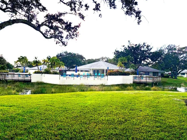 a view of a house with a big yard