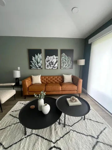 a living room with furniture and a table