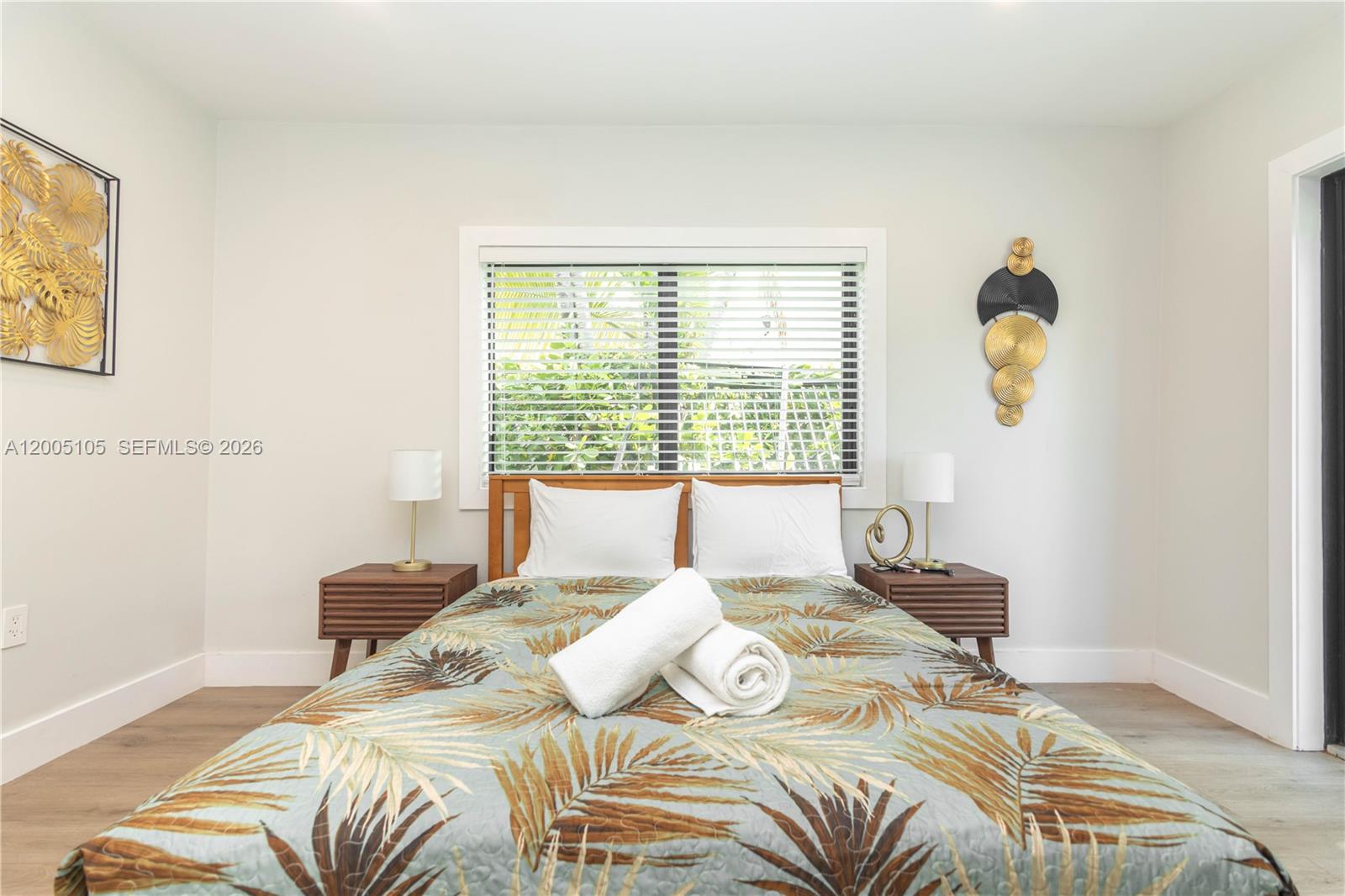 2360 Southwest 12th Street Miami, FL 33135 - Photo 15 of 54 a bedroom with a bed a couch and a window