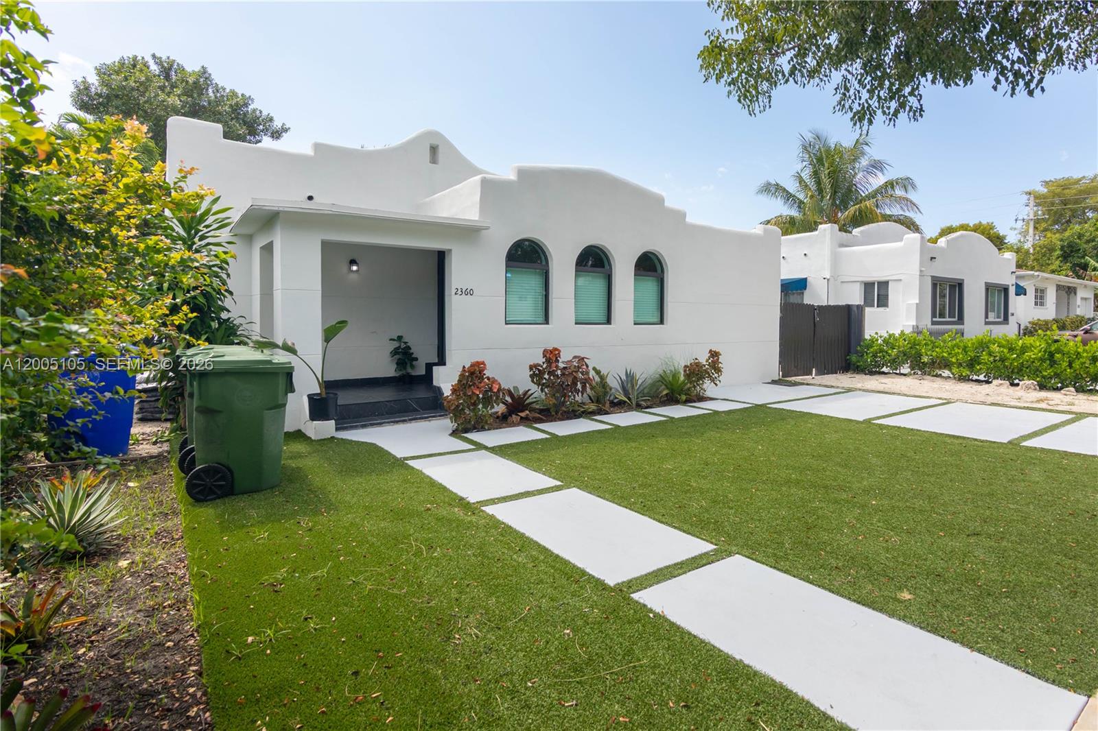 2360 Southwest 12th Street Miami, FL 33135 - Photo 2 of 54 a front view of house with yard and outdoor seating