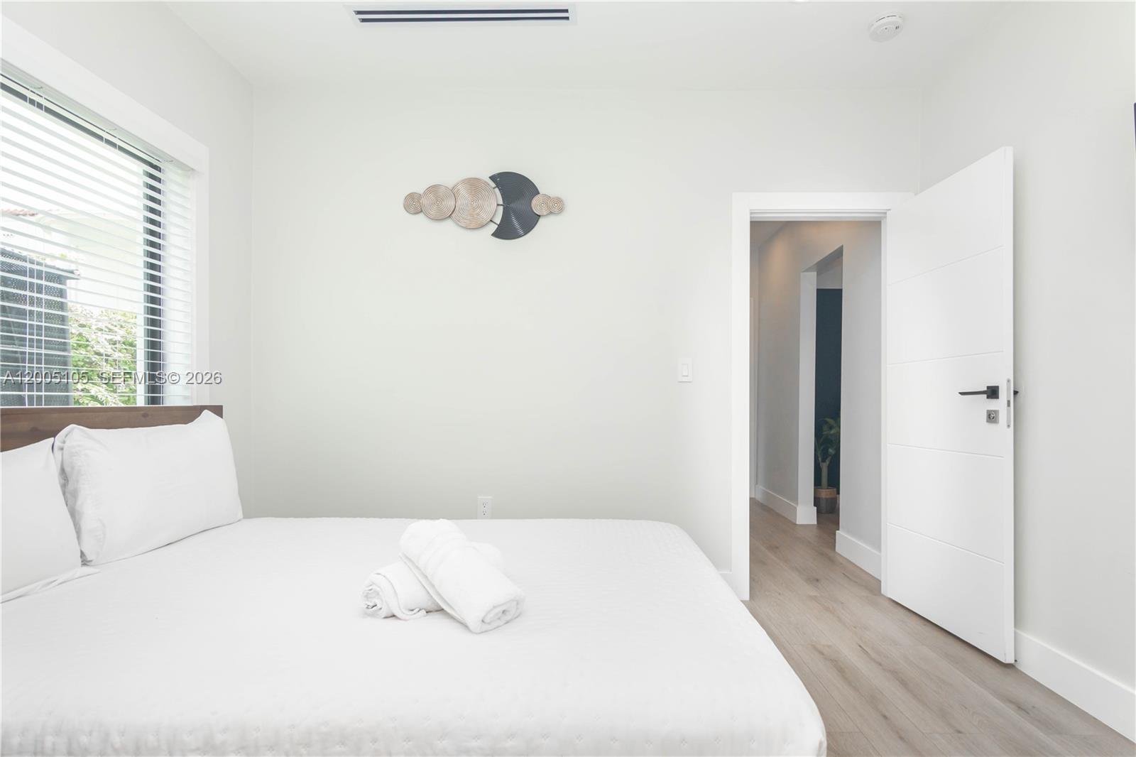 2360 Southwest 12th Street Miami, FL 33135 - Photo 23 of 54 a bedroom with a bed and a window