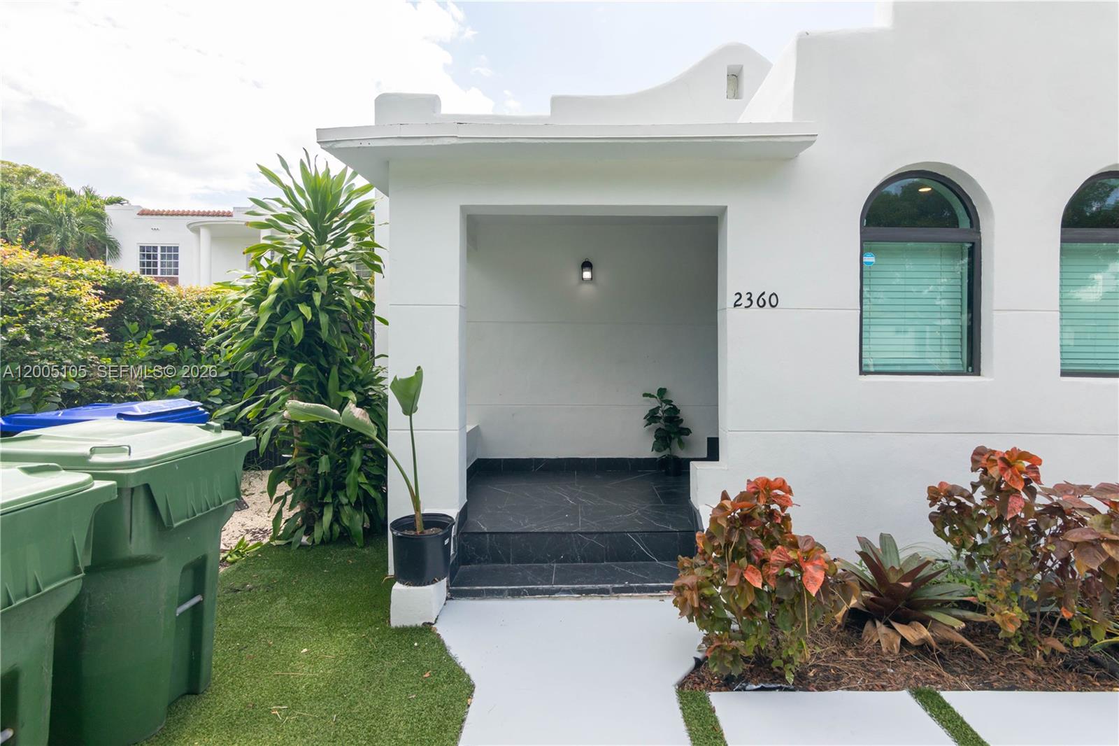 2360 Southwest 12th Street Miami, FL 33135 - Photo 24 of 54 a front view of a house with a yard