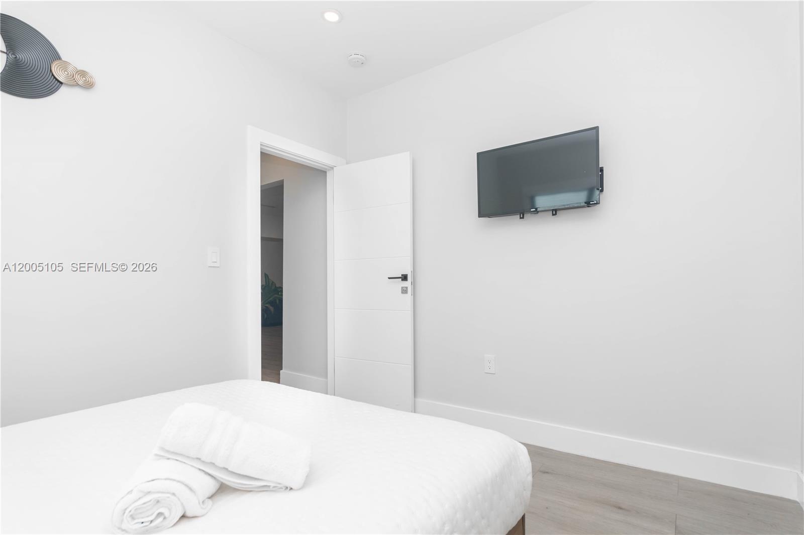 2360 Southwest 12th Street Miami, FL 33135 - Photo 25 of 54 a bedroom with a bed and a flat screen tv