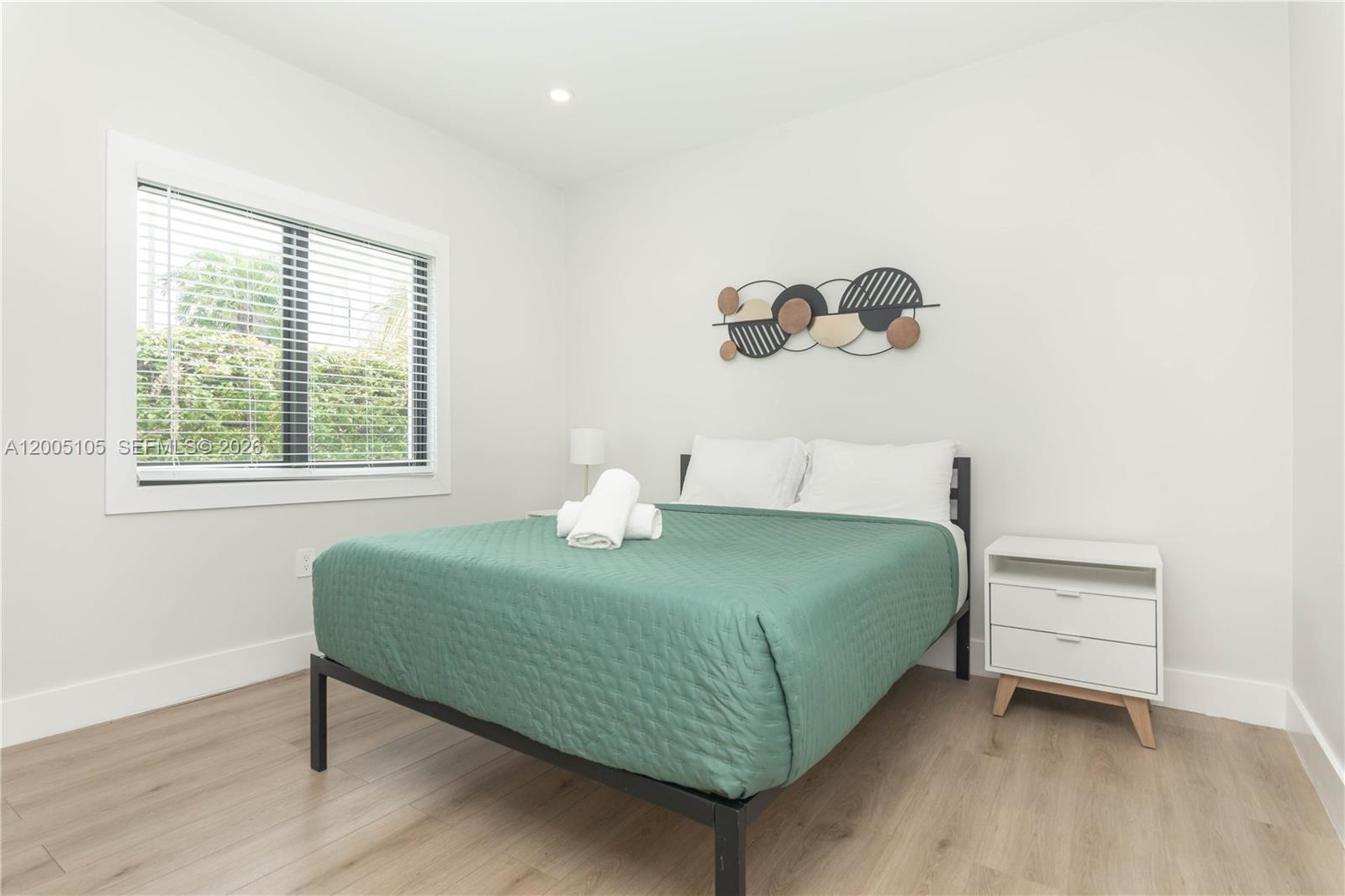 2360 Southwest 12th Street Miami, FL 33135 - Photo 26 of 54 a bedroom with a bed and a window