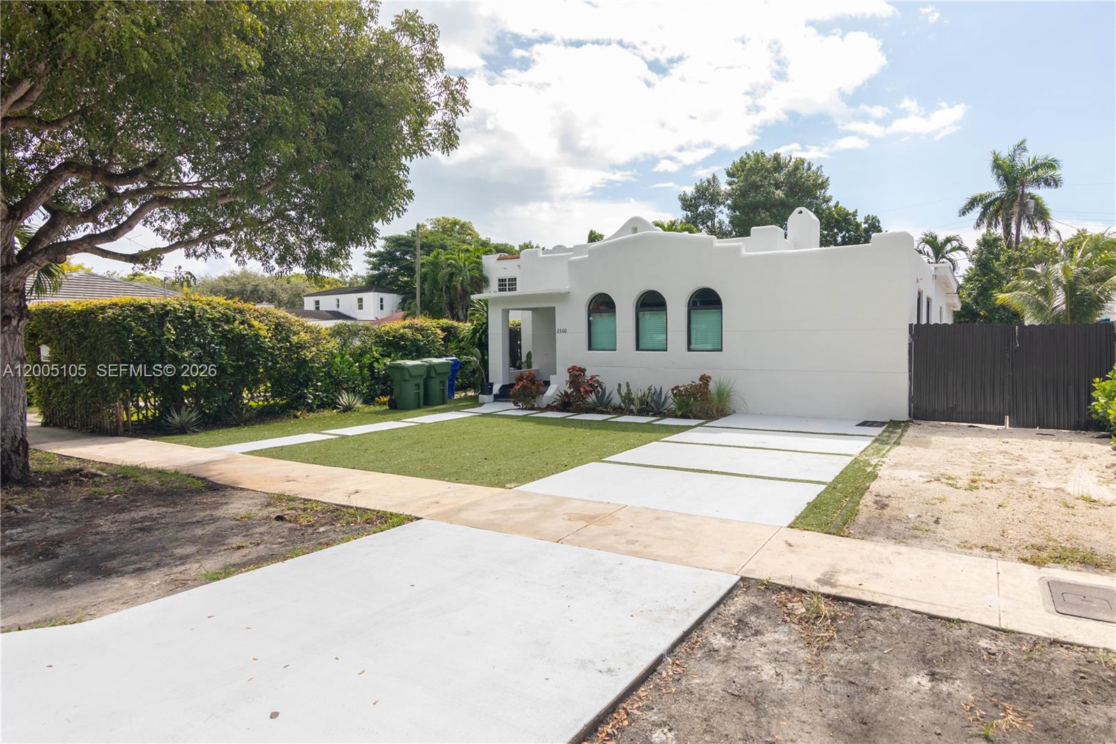 2360 Southwest 12th Street Miami, FL 33135 - Photo 3 of 54 a front view of a house with a yard