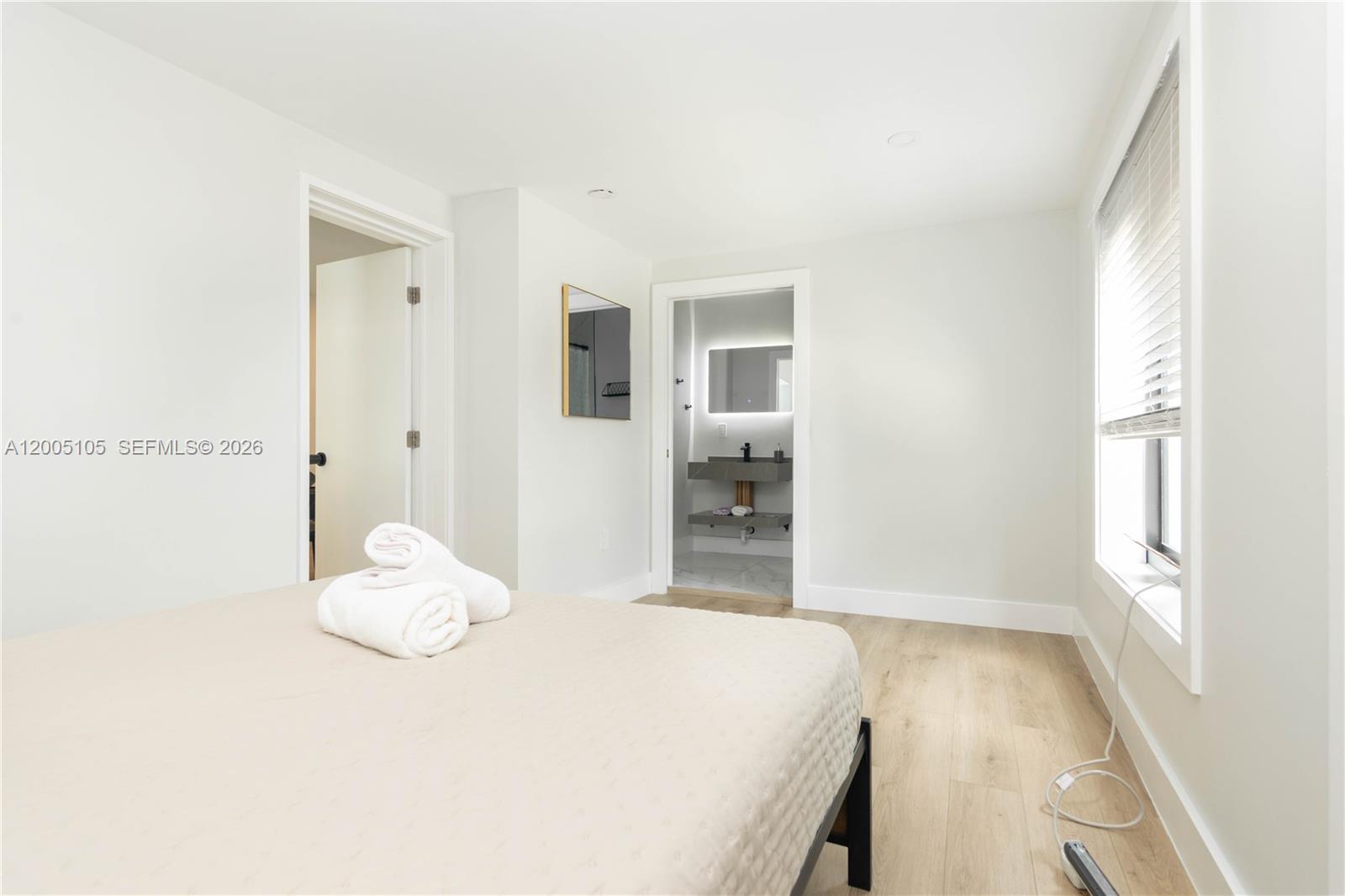 2360 Southwest 12th Street Miami, FL 33135 - Photo 34 of 54 a bedroom with a bed and a window