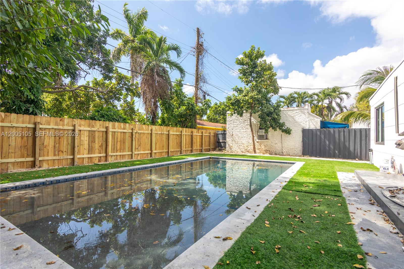 2360 Southwest 12th Street Miami, FL 33135 - Photo 38 of 54 a view of swimming pool with a patio and wooden fence