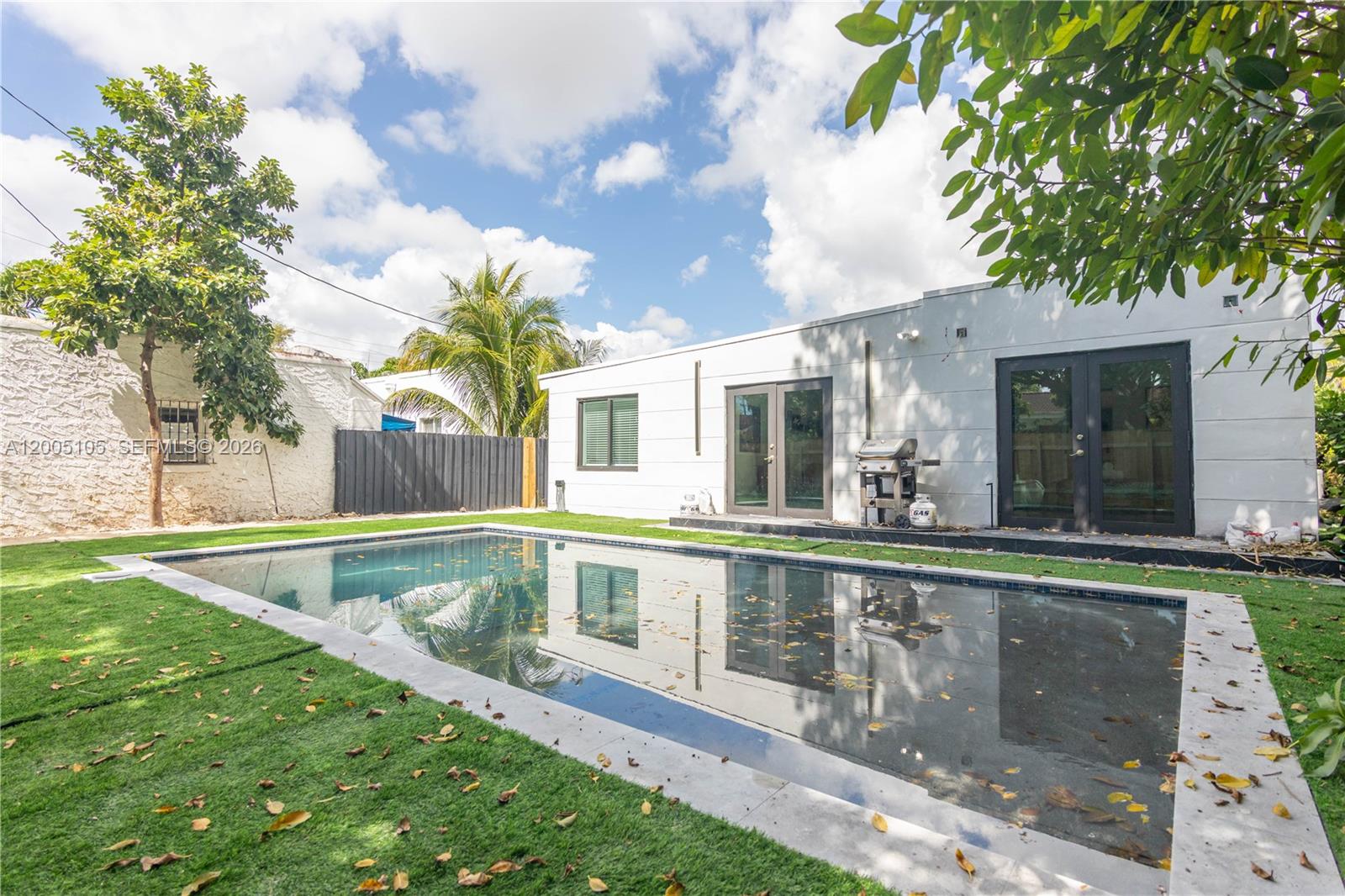 2360 Southwest 12th Street Miami, FL 33135 - Photo 40 of 54 a view of a house with backyard and sitting area