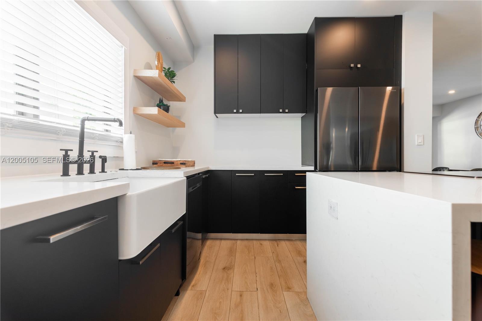 2360 Southwest 12th Street Miami, FL 33135 - Photo 48 of 54 a kitchen with a sink and a refrigerator