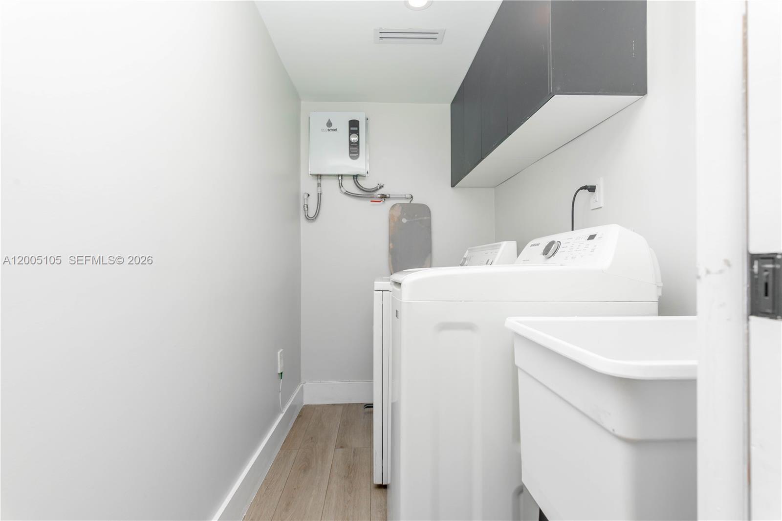 2360 Southwest 12th Street Miami, FL 33135 - Photo 9 of 54 a utility room with dryer and washer