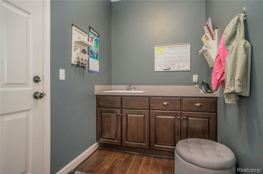 1193 Riverside Street Milford, MI 48381 - Photo 23 of 62 Mud room has large closet, convenient sink and cabinet storage.