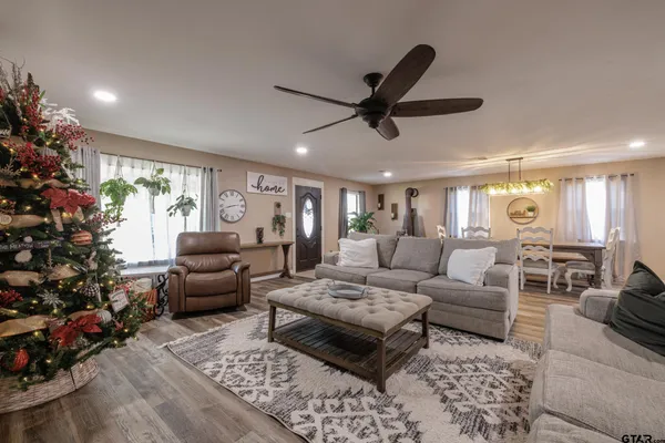 a living room with furniture and a large window