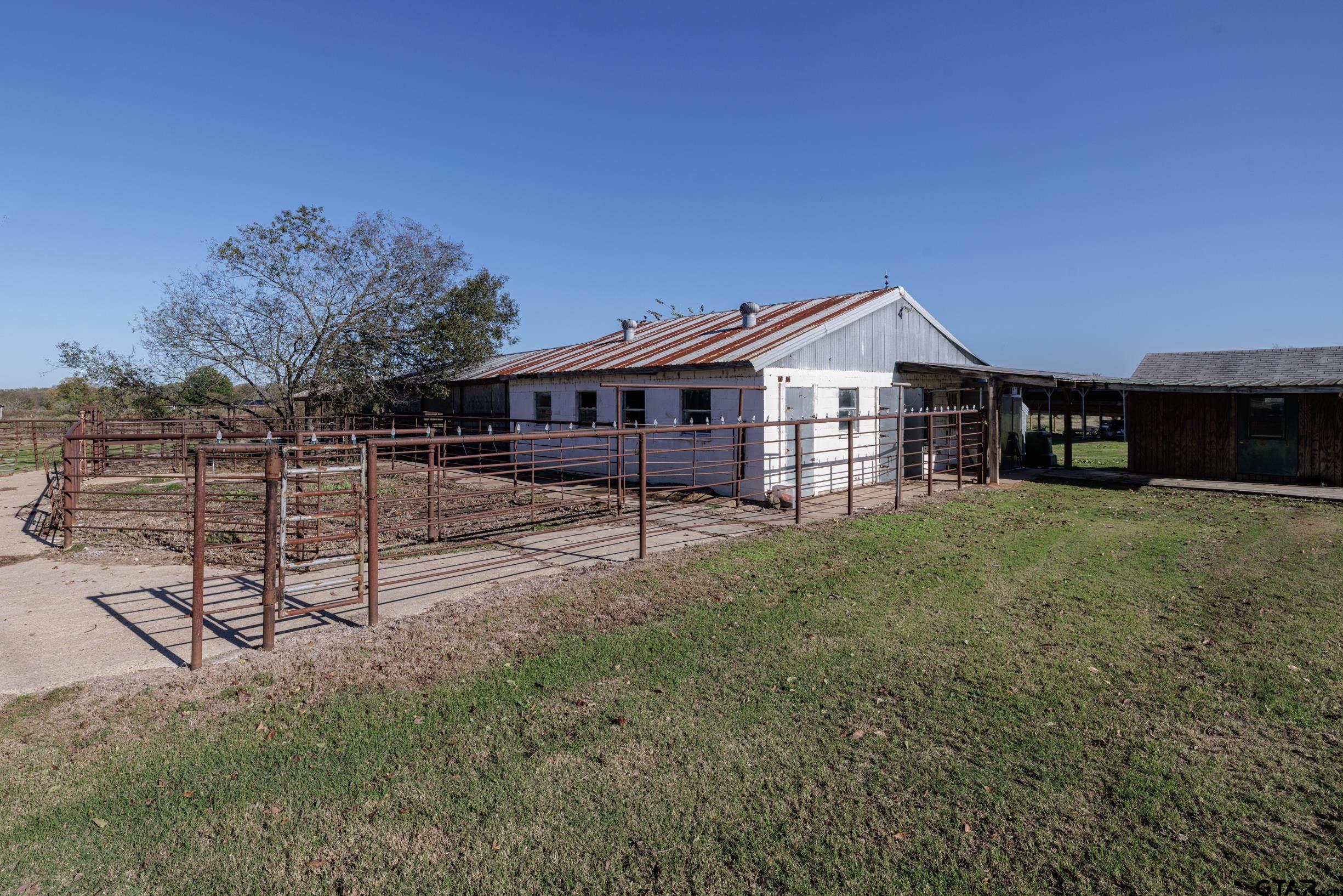 765 County Road 3410 Emory, TX 75440 - Photo 33 of 38 a front view of a house with a yard