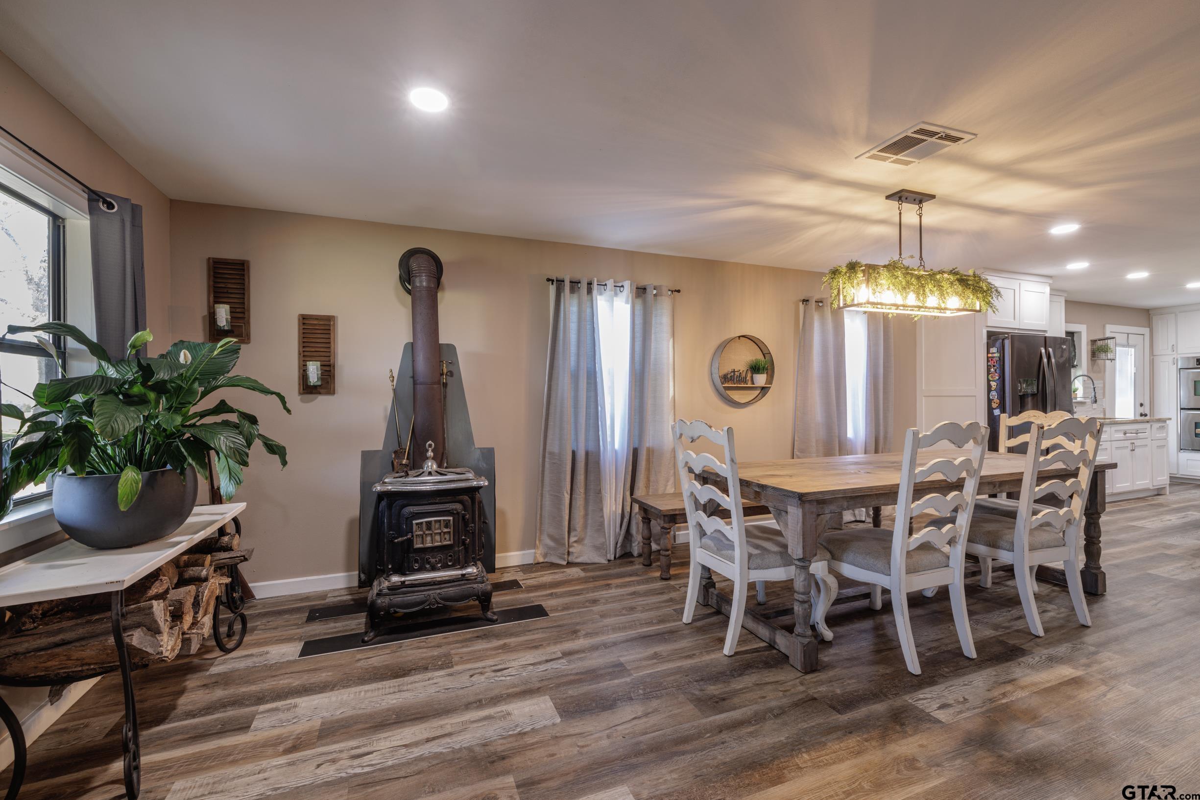 765 County Road 3410 Emory, TX 75440 - Photo 4 of 38 a view of a dining room with furniture window and wooden floor
