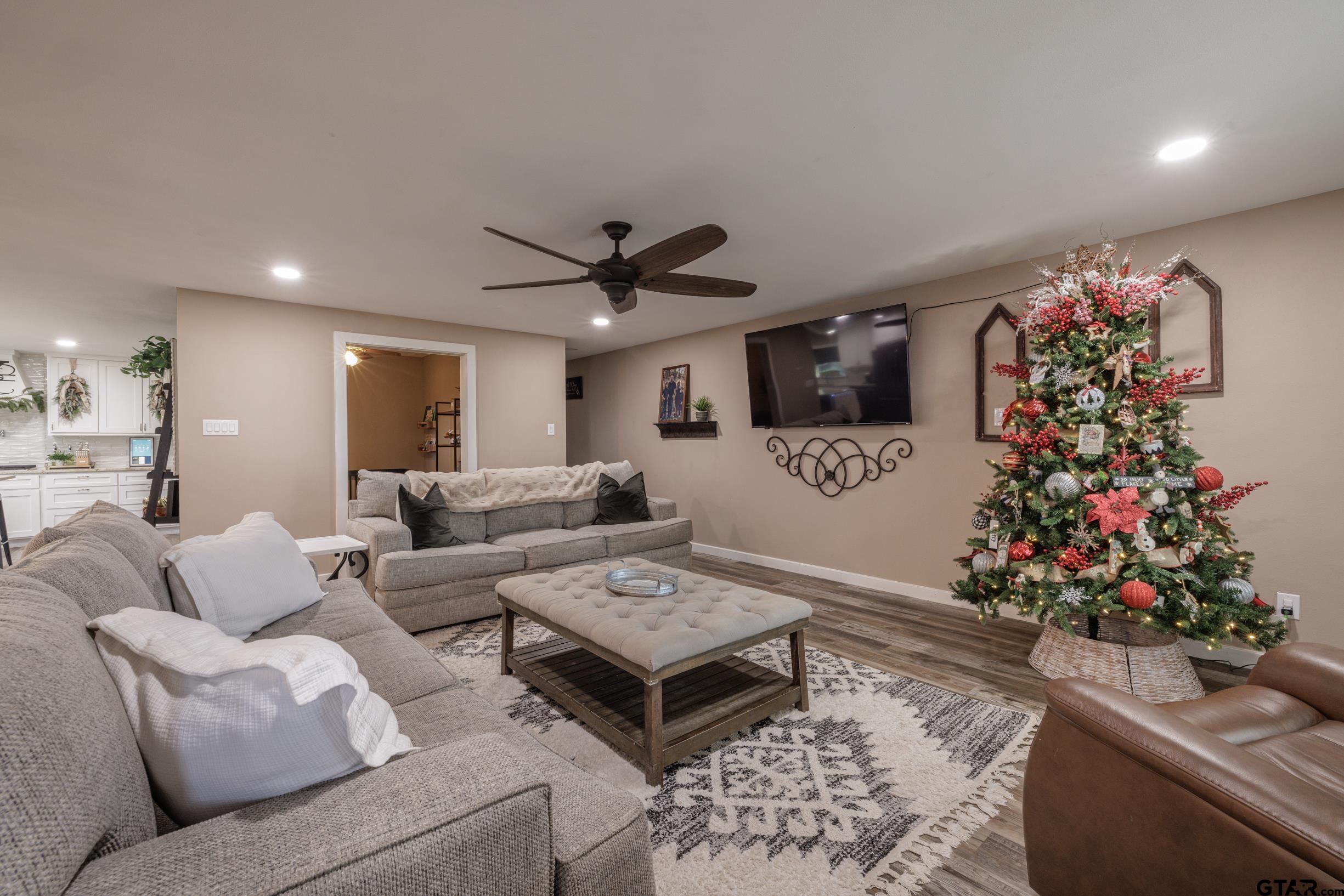 765 County Road 3410 Emory, TX 75440 - Photo 5 of 38 a living room with furniture flowers and a chandelier