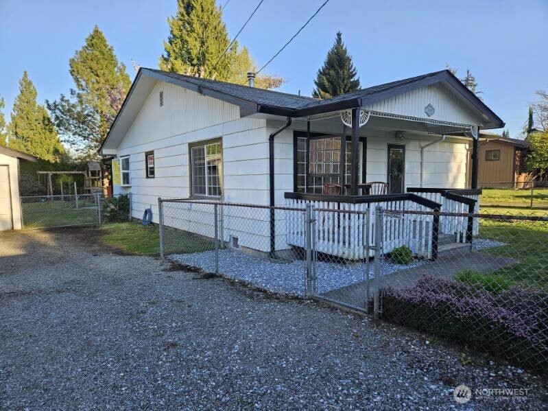 2705 Cedar Road Lake Stevens, WA 98258 - Photo 1 of 1 a view of a house with a yard and wooden fence