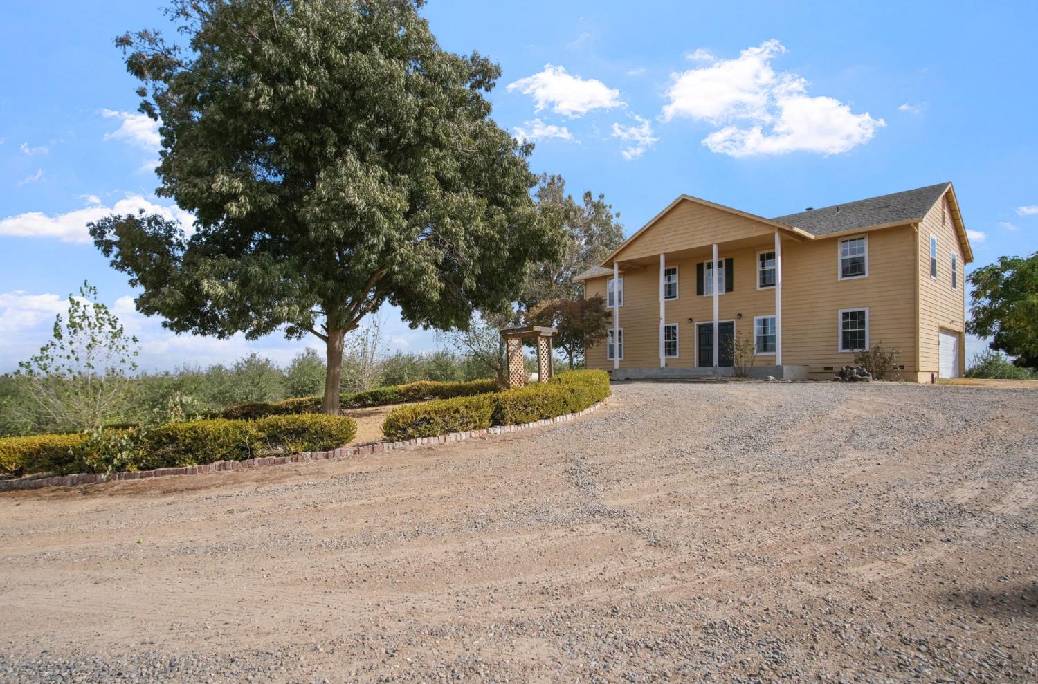 18624 Lake Road Hickman, CA 95323 - Photo 2 of 34 a view of a house with a yard
