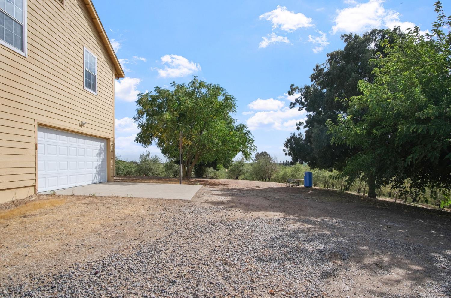 18624 Lake Road Hickman, CA 95323 - Photo 9 of 34 a view of a house with a tree
