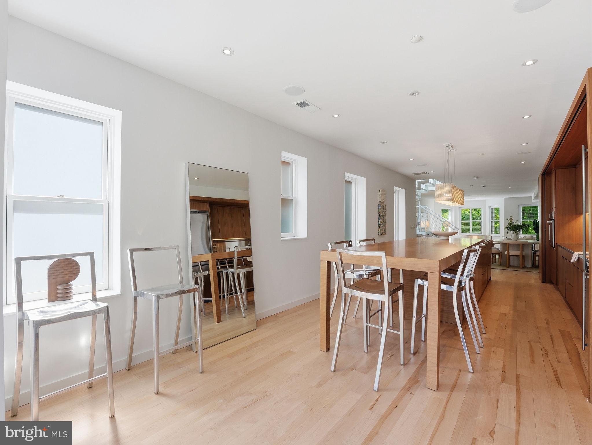 1845 Calvert Street Northwest Washington, DC 20009 - Photo 18 of 48 a dining room with furniture and wooden floor