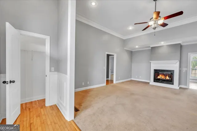 a kitchen with kitchen island granite countertop a stove a sink and a window
