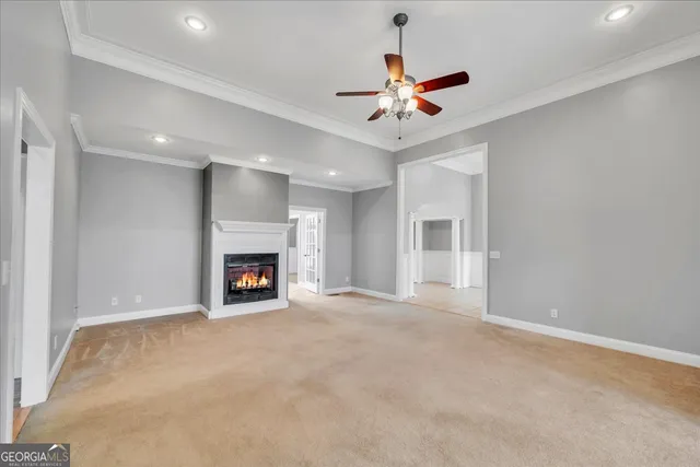 a kitchen with stainless steel appliances granite countertop a sink a stove and a wooden floors