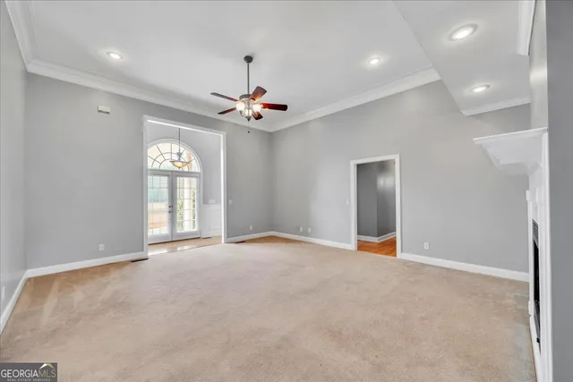 a kitchen with stainless steel appliances granite countertop a stove a refrigerator and a sink