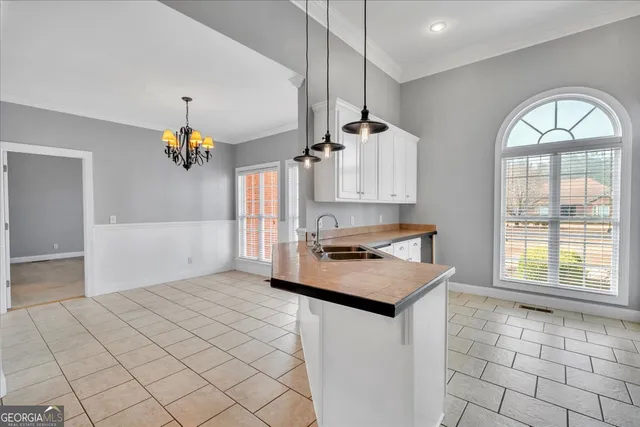 a view of a livingroom with a ceiling fan and window