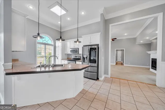 an empty room with a window and a ceiling fan
