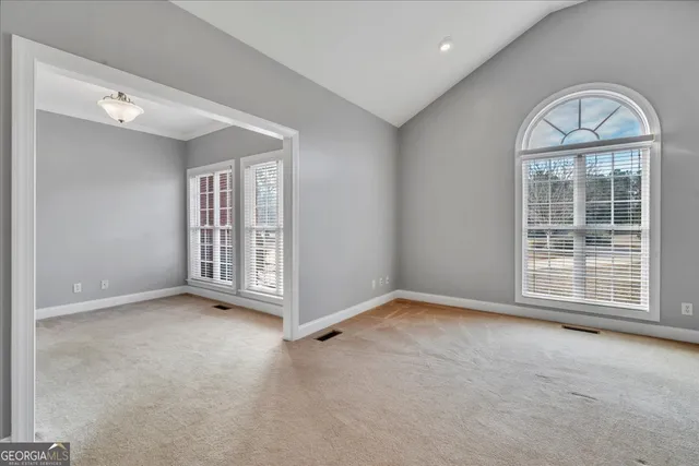 a view of a house with swimming pool and a yard