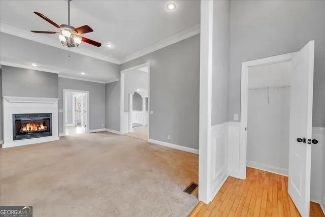 a view of empty room with a fireplace