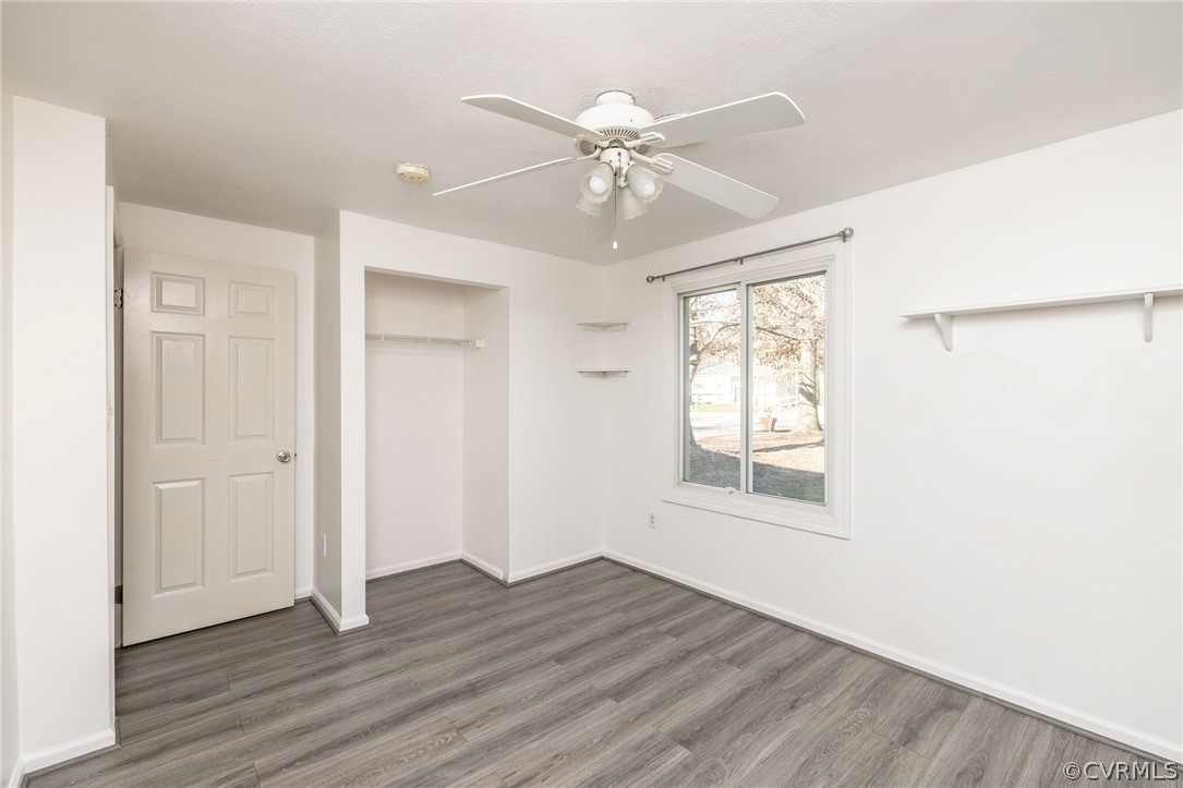 10112 Ridgerun Road Chesterfield, VA 23832 - Photo 6 of 27 a view of an empty room with wooden floor and a window
