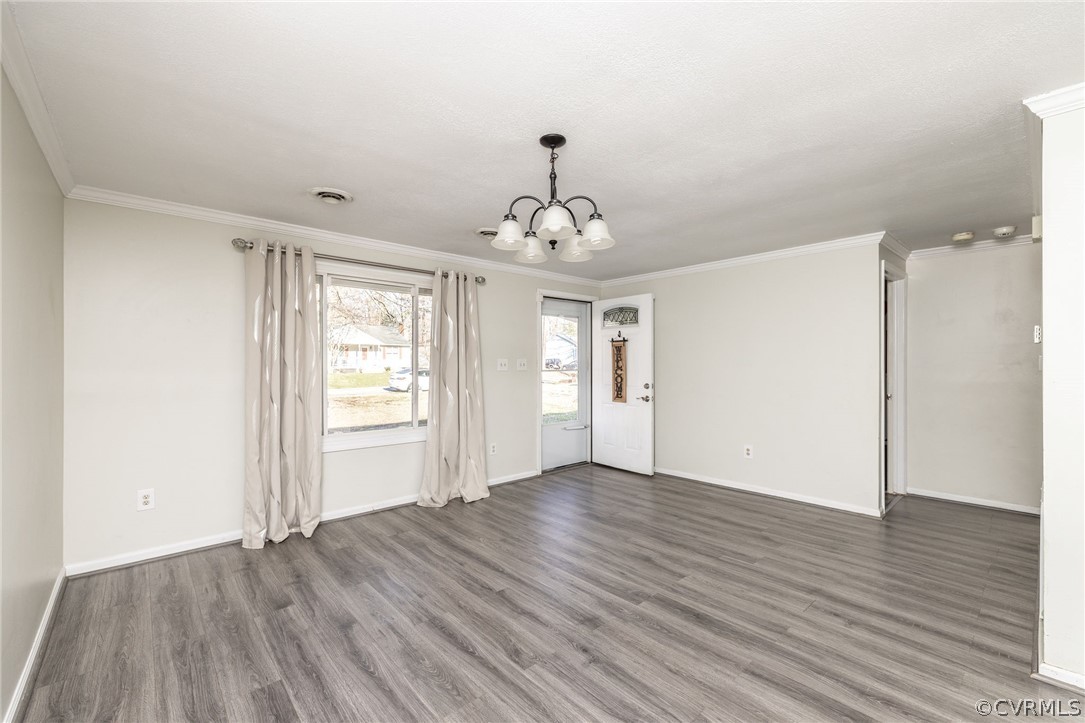 10112 Ridgerun Road Chesterfield, VA 23832 - Photo 10 of 27 an empty room with wooden floor chandelier and windows