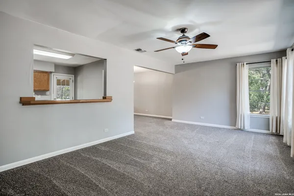 a view of an empty room with a window