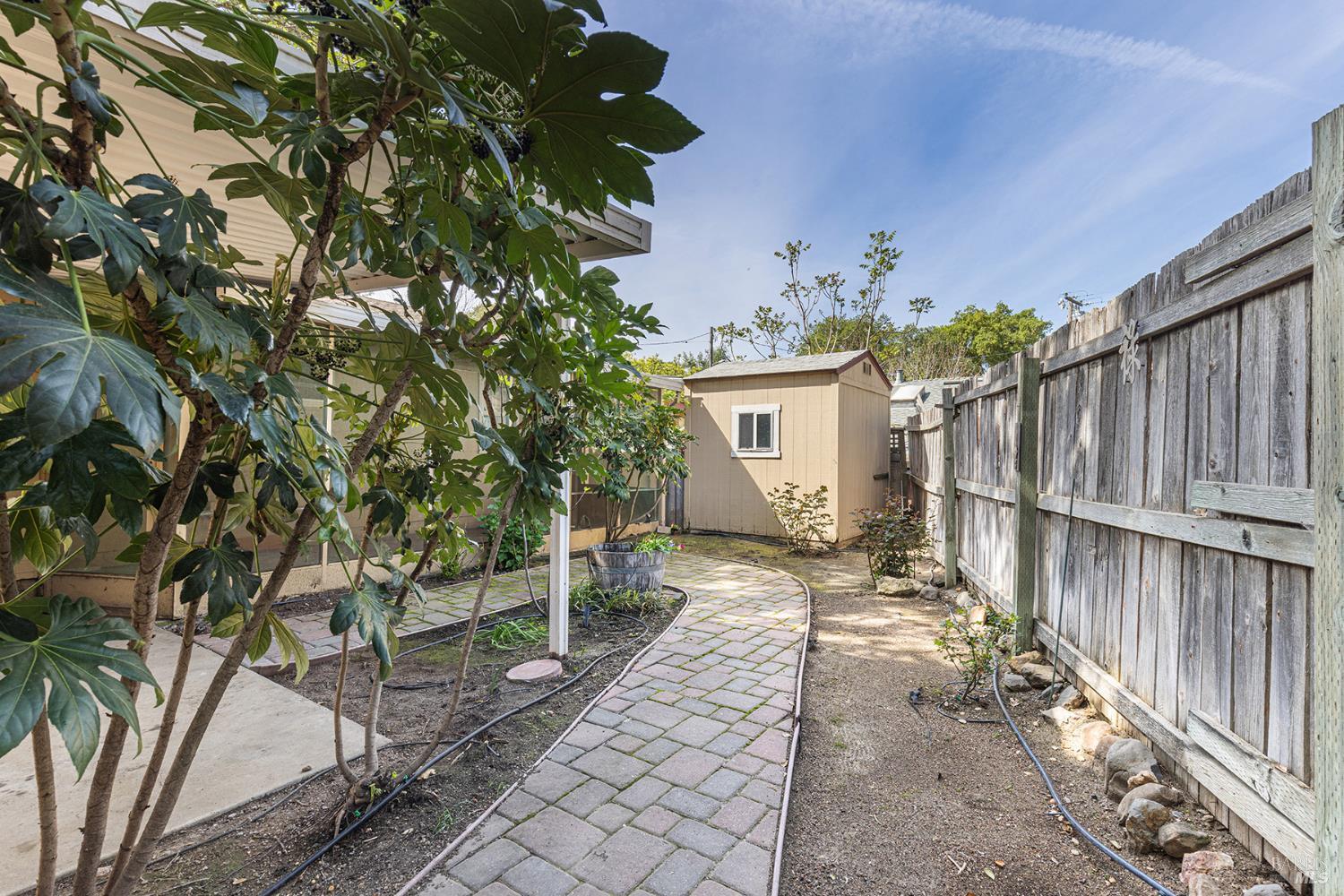 18090 Las Lomas Road Sonoma, CA 95476 - Photo 28 of 37 a view of a backyard with wooden fence and a bench