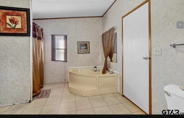a bathroom with a sink a mirror and a bathtub