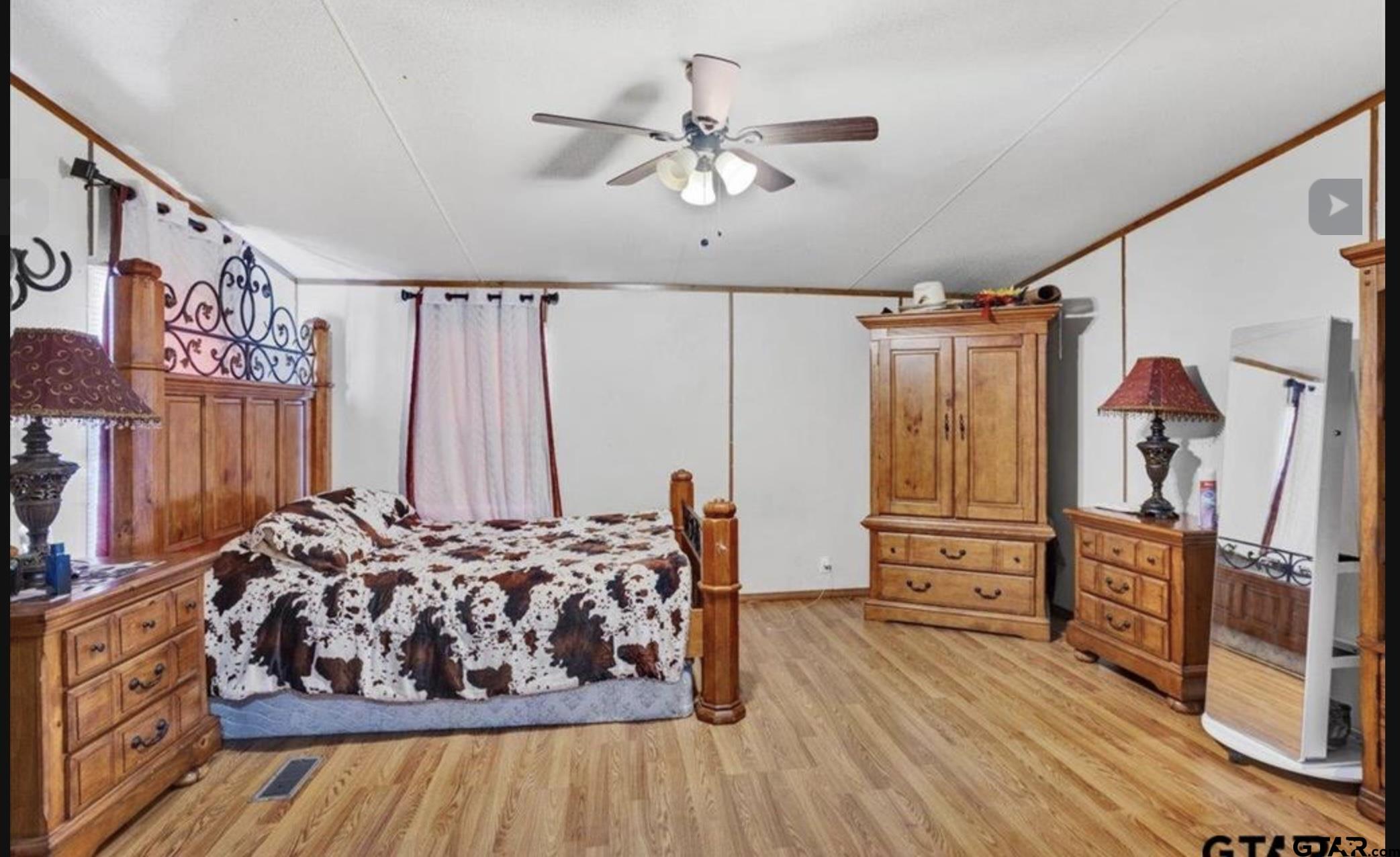 865 County Road Saltillo, TX 75478 - Photo 14 of 22 a living room with furniture and a flat screen tv