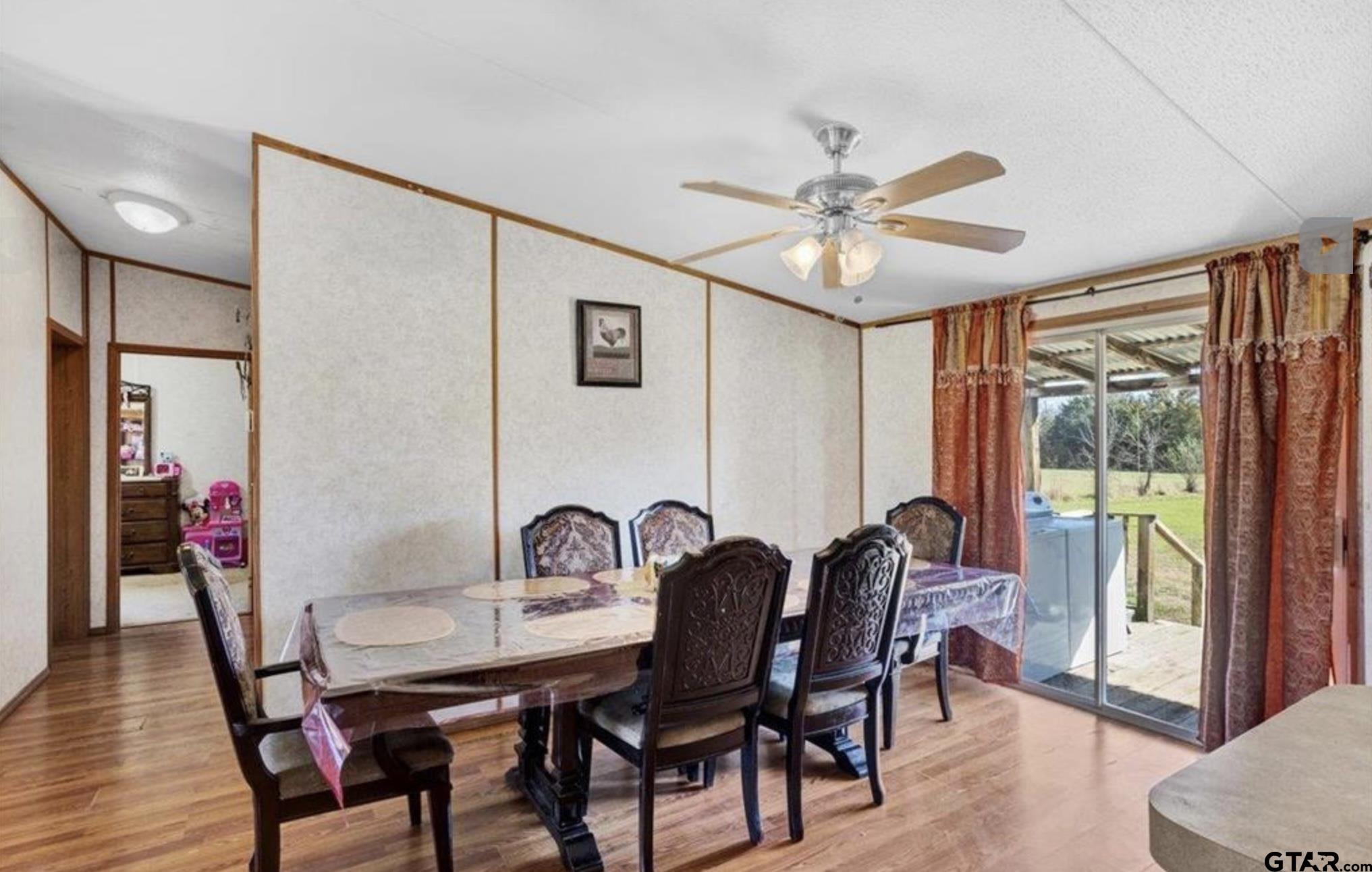 865 County Road Saltillo, TX 75478 - Photo 19 of 22 a view of a a dining room with furniture window and wooden floor