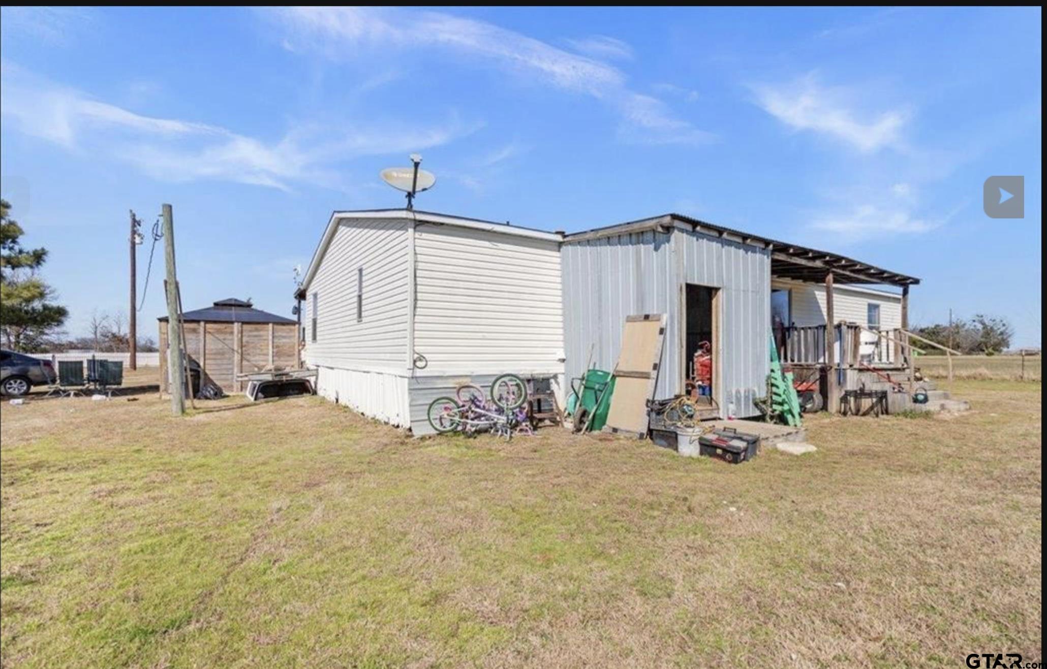 865 County Road Saltillo, TX 75478 - Photo 5 of 22 a view of a house with outdoor space
