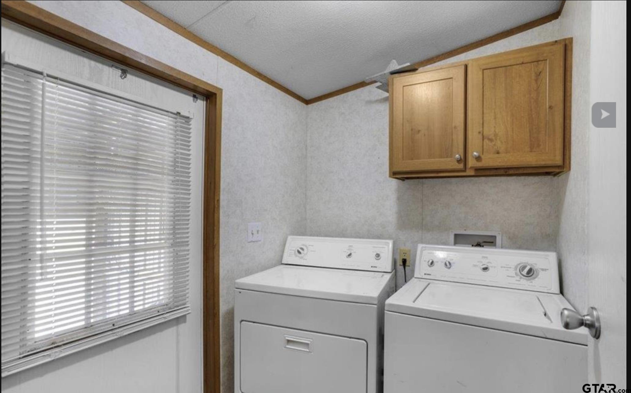 865 County Road Saltillo, TX 75478 - Photo 6 of 22 a utility room with dryer and washer