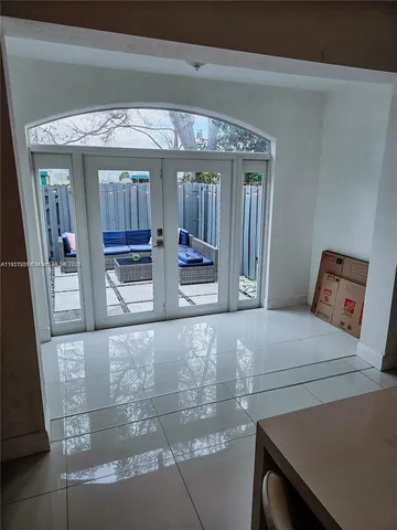 a bedroom with bed and window