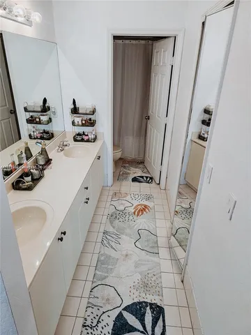 a bathroom with a sink and mirror
