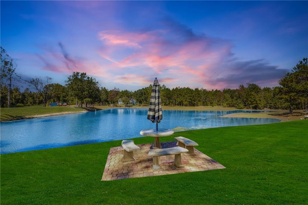 110 Bethel Village Road Eastman, GA 31023 - Photo 3 of 32 a view of a lake with houses in the back